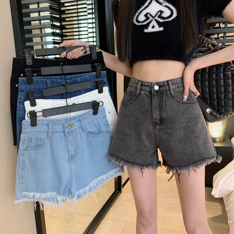 THE DISTRESSED HIGH-RISE DENIM SHORTS